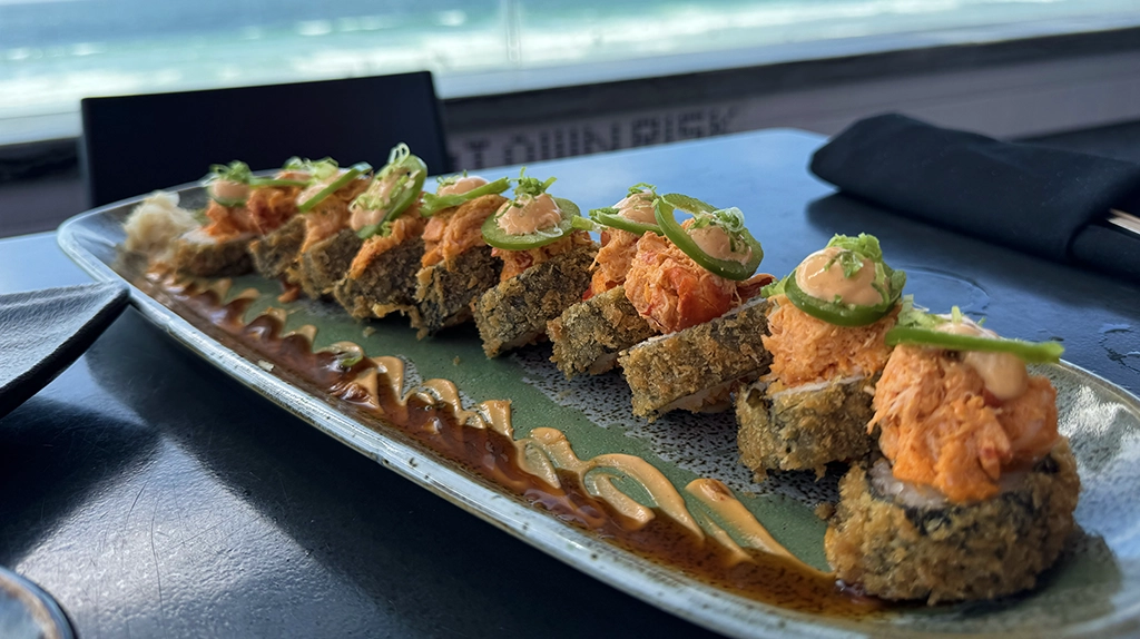 A plate of sushi overlooking the Pacific Ocean