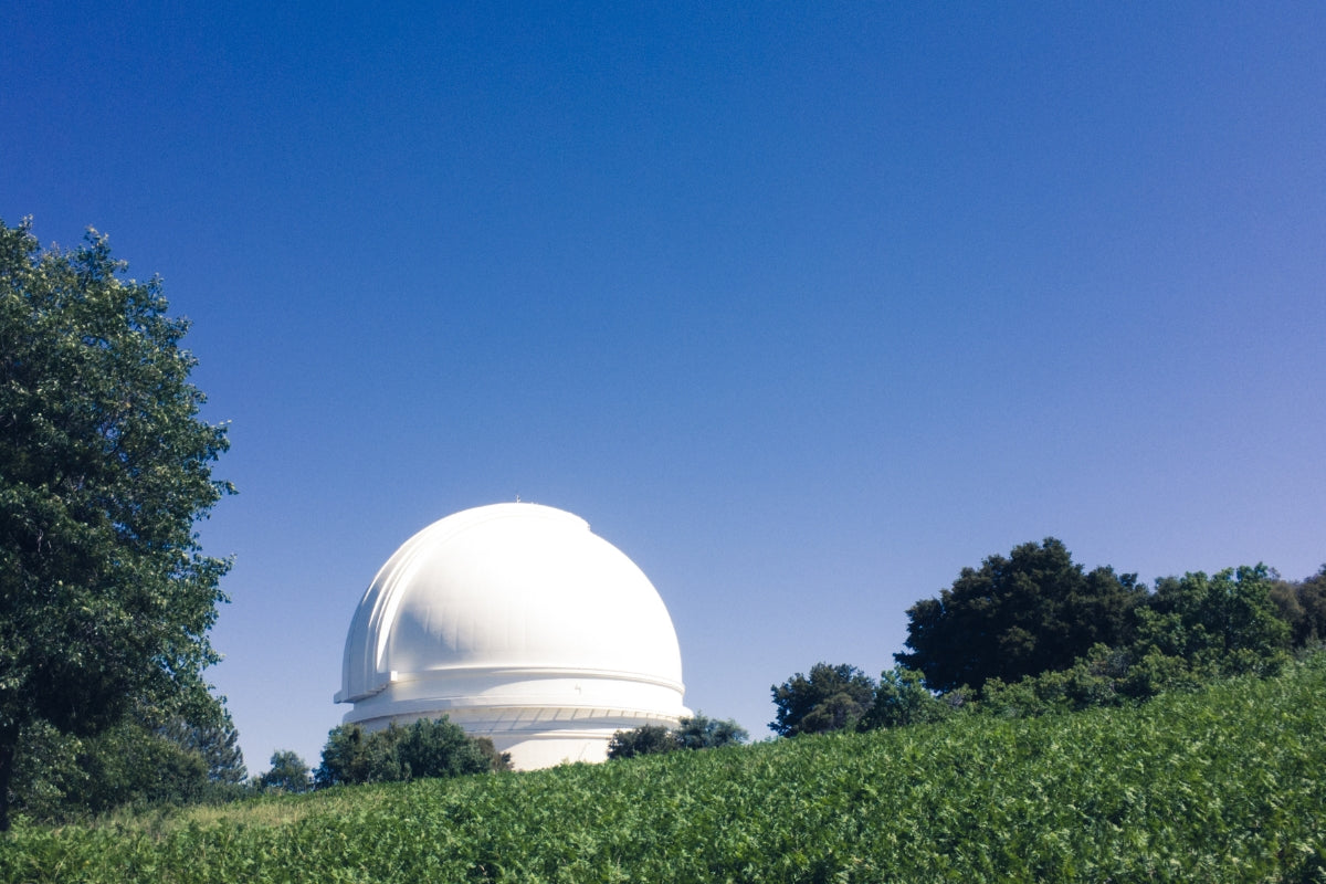 Cyclist biking along Coronado Island coastal path