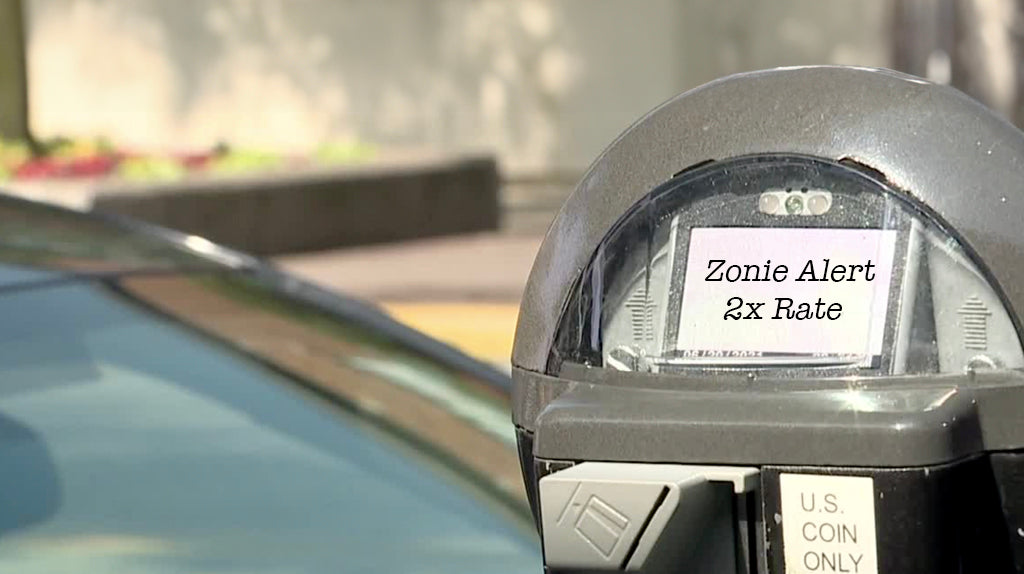 Parking meter with text photoshopped that says "Zonie Alert 2x Rate"