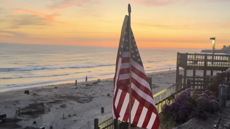 American Flag at the Pacific Beach Boardwalk during sunset.