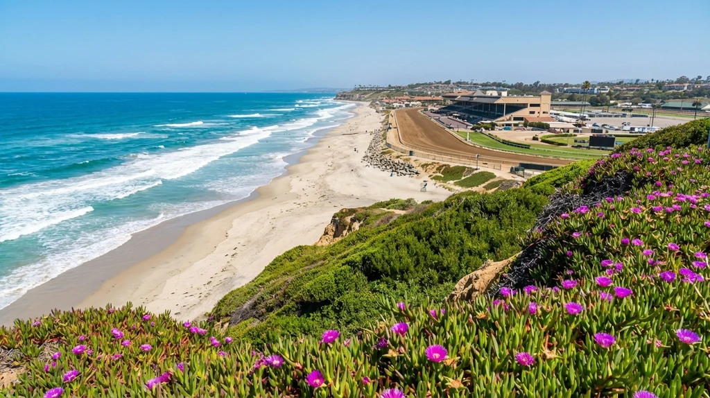 Del Mar coastline view from the bluffs with sandy beach and turquoise ocean on a sunny California day